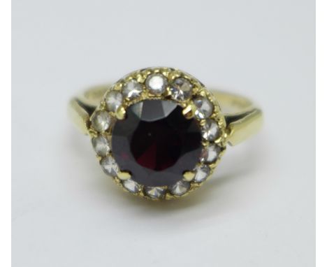 A 9ct gold, garnet and clear stone ring, M, 3.3g 