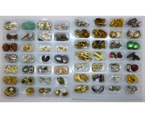 A collection of fifty-six pairs of clip-on earrings, some vintage 