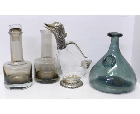 A novelty plated duck claret jug, a Holmegaard glass carafe and two Caithness glass decanters, one lacking stopper 