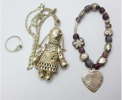 A large silver ragdoll pendant and chain, a silver bracelet and a silver and CZ ring, Q 