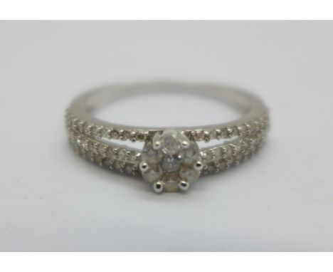 A 9ct white gold ring set with 67 diamonds, 2.6g, S 