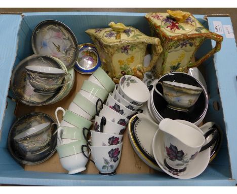 A collection of china including two cups and saucers with a dragon design, a Royal Albert tea set and one other and two Wade 