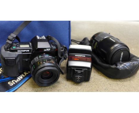 An Olympus OM707 camera and additional 70-210mm Olympus lens, flash, with bag 