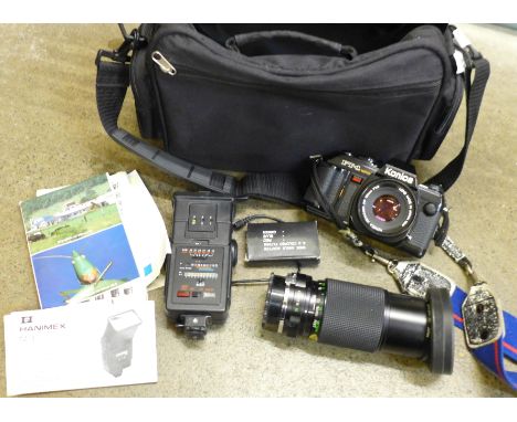 A Konica FT-1 camera, with additional 80-210mm lens, flash and filters and bag 