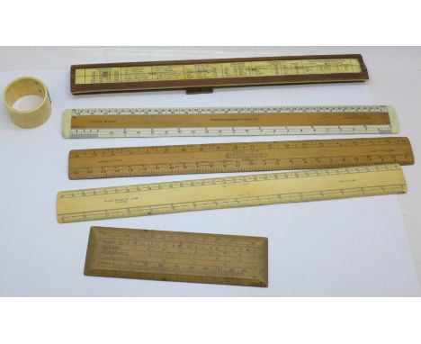 Assorted ivory, bone and wooden rulers and a napkin ring 