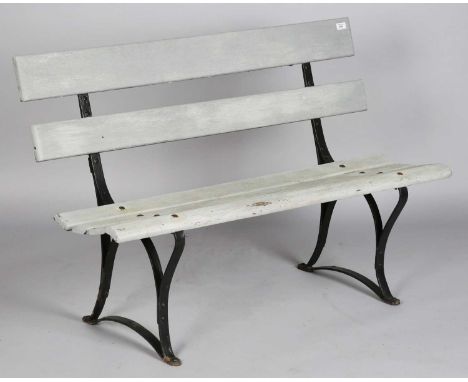 A late 19th/early 20th century wrought and wooden slatted garden bench, height 81cm, width 122cm, depth 50cm.