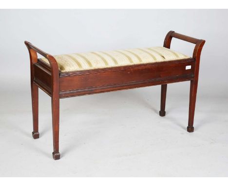 An early 20th century mahogany duet piano stool with adjustable hinged seat, height 60cm, width 102cm, depth 35.5cm.