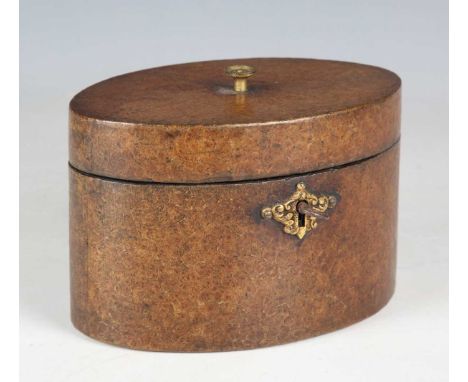A George III thuya wood oval tea caddy with a gilt metal foliate key escutcheon, width 17cm.