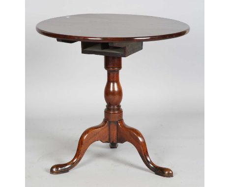 A George III mahogany circular tip-top supper table with a birdcage mount and tripod legs, height 71.5cm, diameter 74cm (some