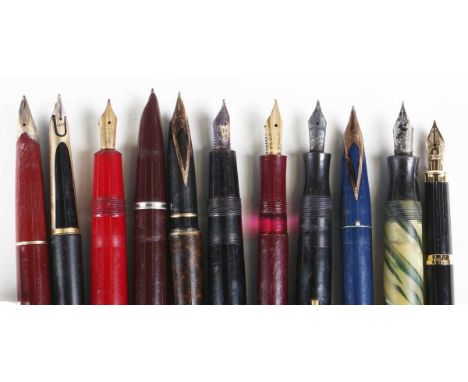 A collection of fountain and ballpoint pens and propelling pencils, including two Parker Duofolds, two other Parkers, two She