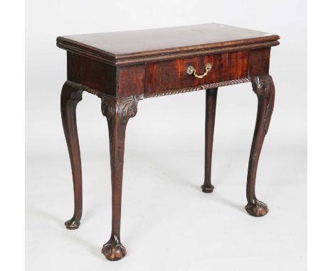 A George II mahogany fold-over card table, raised on carved cabriole legs and claw and ball feet, height 74cm, width 76cm, de
