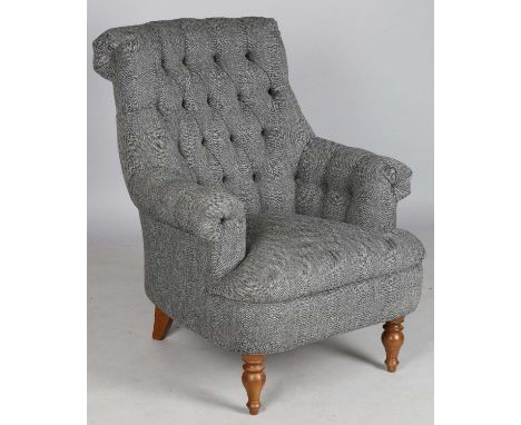 A modern button back armchair by Wood Bros, upholstered in a grey herringbone tweed, height 100cm, width 83cm, depth 88cm.