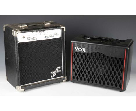 A First Act MA215 bass amplifier, width 33cm, and a Vox VX-1 modelling guitar amplifier.