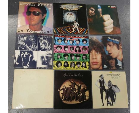 A small collection of records, including LPs by Fleetwood Mac, The Rolling Stones and The Beatles, and singles by Bob Dylan.