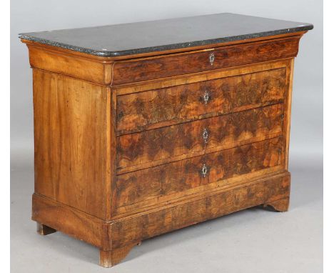 A Louis Philippe walnut four-drawer commode with a dark grey marble top, height 94cm, width 131cm, depth 60cm.