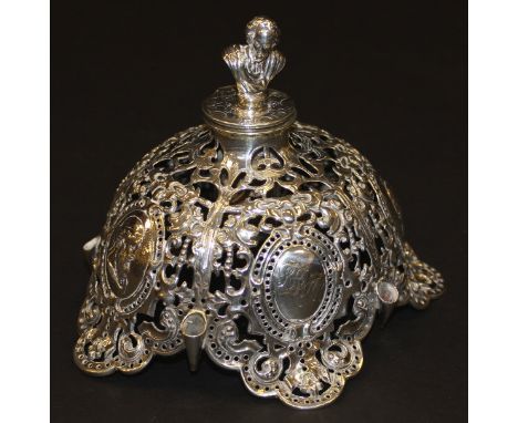 A Victorian silver ink / quill stand centrepiece of domed form with pierced and embossed decoration, depicting various Roman 