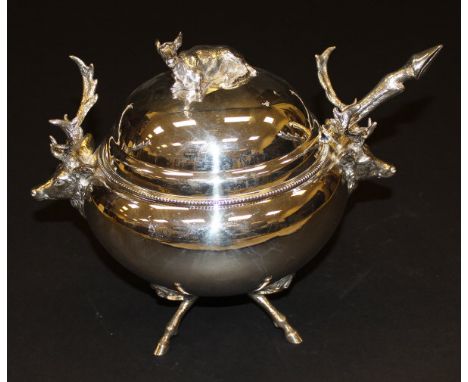A plated soup tureen with cover, the domed top set with recumbent fawn finial and the body with a pair of stag head handles, 
