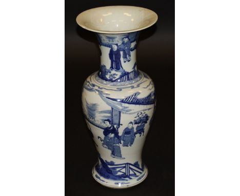 A Chinese blue and white baluster shaped vase with wide flared rim, the main body decorated with figures in an interior, the 