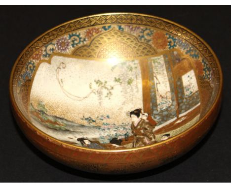A Meiji period Japanese Satsuma ware bowl decorated with figures in an interior, raised on a circular foot, bearing black on 