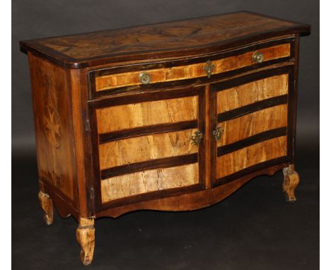 An 18th Century Maltese walnut (and possibly olive wood) serpentine fronted commode, the quartered top set with two parquetry