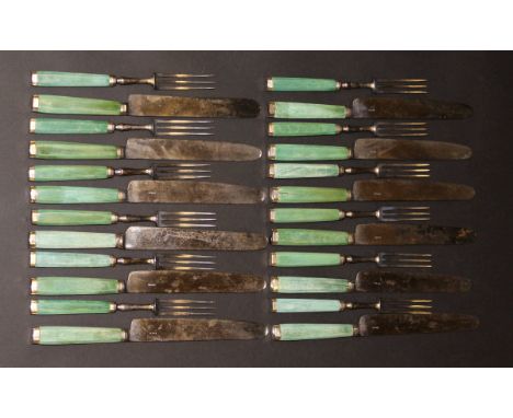 A set of twelve 19th Century stained green ivory handled knives and forks with white metal mounts, ten of the knife blades st