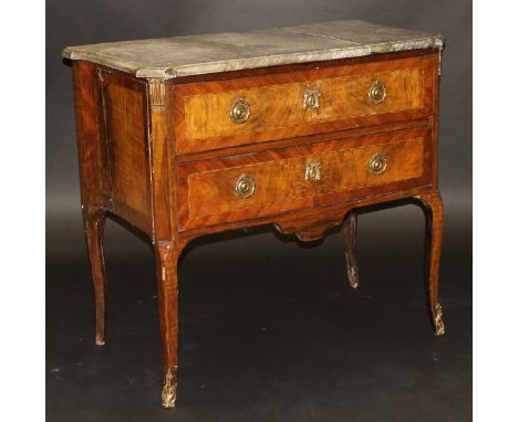 An 18th Century French walnut and kingwood cross-banded commode, the grey marble top over two drawers on cabriole supports to
