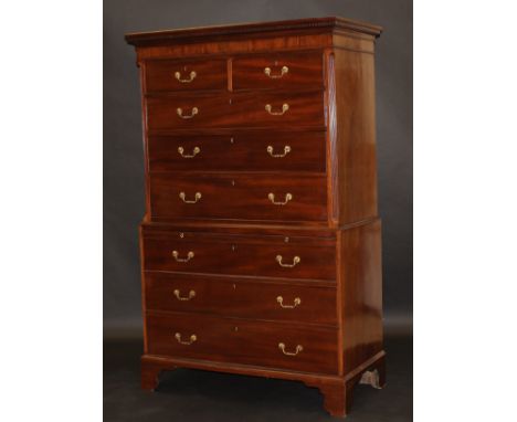 A 19th Century mahogany chest on chest, the upper section with dentil cornice above two short and three long drawers with orn
