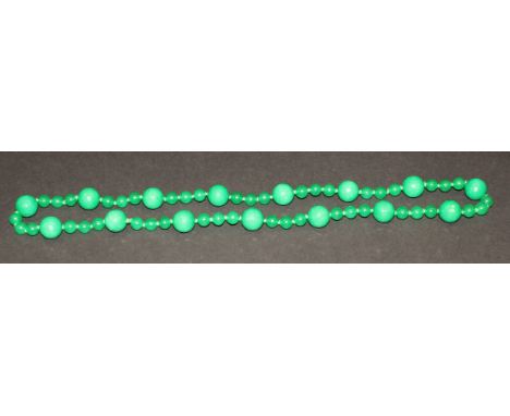 A green jade beaded necklace, approx 81.5 cm long