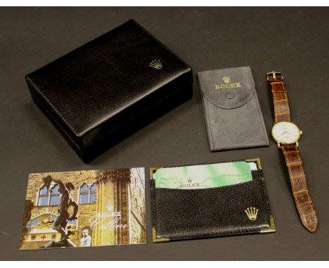 A Rolex Cellini 18 carat gold wristwatch, the textured dial set with Roman numerals, the back stamped "5115 K653105 18K", hou