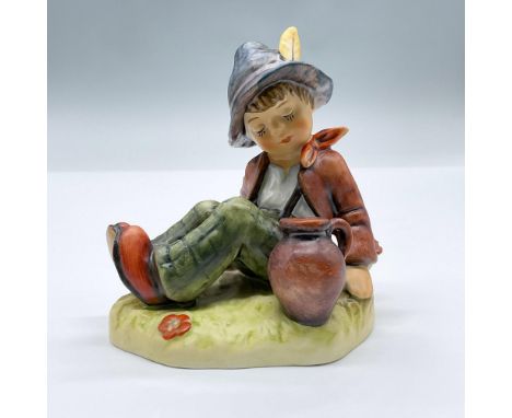 This porcelain figure showcases a seated boy with a pot of coffee. Marked Goebel Hummel 409, Exclusive Special Edition No.8 f