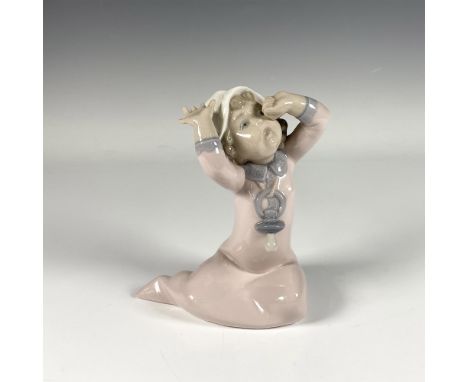 Adorable glossy figure of capturing a lively moment of a baby yawning with her arms up, in serene pastel tones. Lladro backst