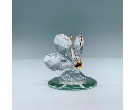 Spectacular clear crystal miniature of a butterfly with crystal tipped gold antennae. Swarovski swan mark. This item has its 