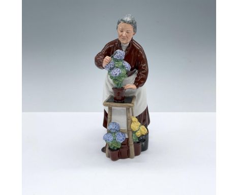 Hand decorated figure of an elderly florist attending to a pot of flowers. Royal Doulton backstamp. Artist: Mary NicollIssued