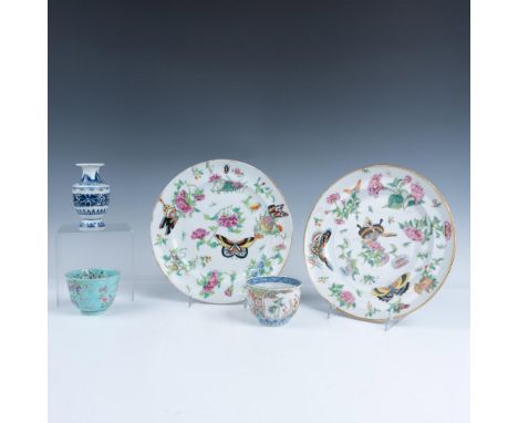 This striking set includes two teacups and two plates adorned with hand-painted enamel decorations and gilt embellishments, a