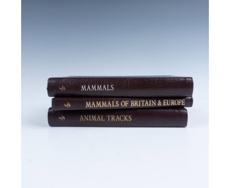 A set of 3 collector's Lifetime edition bound field guides in dark brown genuine leather covers with dark purple bookmark rib