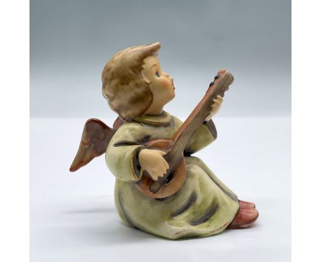 Adorable porcelain figure of an angel playing a mandolin. Marked Goebel Hummel 438. Issued: 1984Dimensions: 3.75"L x 2.5"W x 