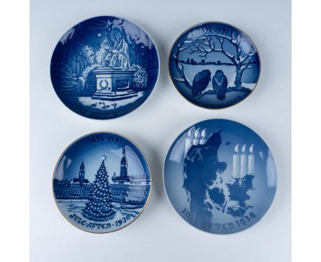 Fantastic set of holiday themed dishes that includes two gilt bordered plates depicting a Christmas tree and the other depict