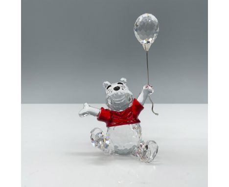 Kind and lovable clear crystal figure 905768 with a red shirt depicting a bear happily holding a balloon on a silver toned me