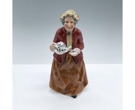 Hand decorated and hand painted figure of an elderly woman with a cup tea and teapot. Brown and khaki-tan colorations. Royal 