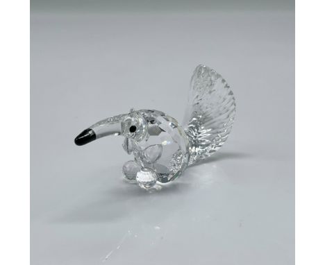 Miniature clear crystal figure has faceted body, black crystal eyes and nose with etched crystal tail. Swarovski backstamp. 2