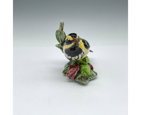 Beautiful hand painted detailed bird figurine. Colored in black, yellow, green and red. Stangl Pottery backstamp. 3814. Issue