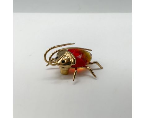 Charming figure of a sterling silver gold plated 8g fire opal beetle magnet that attaches to a lovely acrylic stand. Swarovsk