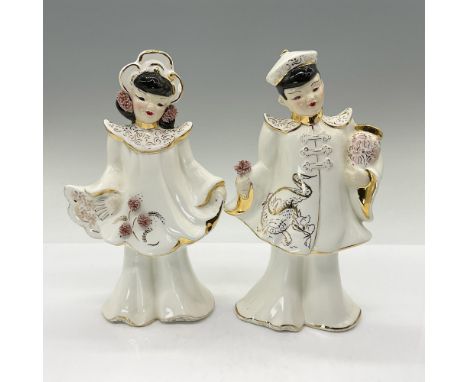 This adorable well-crafted pair are modeled in traditional white and gold-gilded outfits decorated with highly raised applied