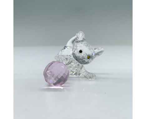 A clear crystal figure of an adorable kitten with melon colored eyes pouncing on its pink ball of yarn. Swarovski backstamp. 