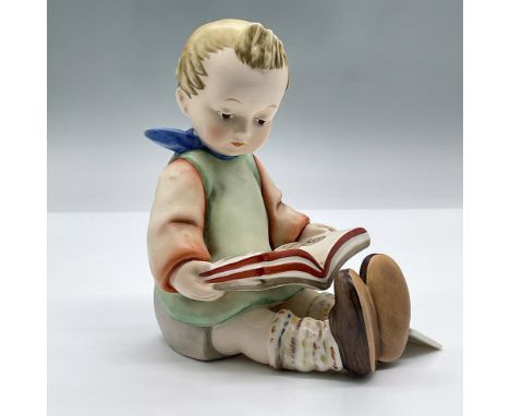 This limited edition porcelain figure features a precious seated boy wearing a blue scarf, reading a book. Marked Goebel 14 A