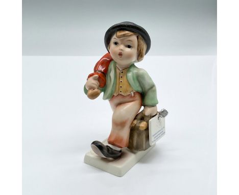 This limited edition porcelain figure features a charming boy carrying an umbrella as he strides forward. Marked Goebel Humme