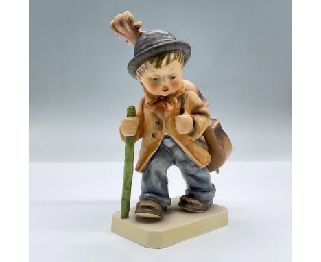 Features a porcelain figure of a boy carrying a cello and walking stick. Marked Goebel 89/II. Issued: 20th centuryDimensions: