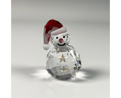 Adorable clear crystal smiling snowman figure with red accents on its cap and nose. Swarovski swan mark. This item includes a