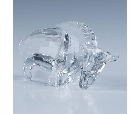 Made of clear crystal with faceted head and body designed to capture and refract light in various directions that intensify a