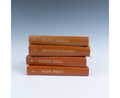 A set of 4 collector's Lifetime edition bound field guides in light brown genuine leather covers with orange bookmark ribbons